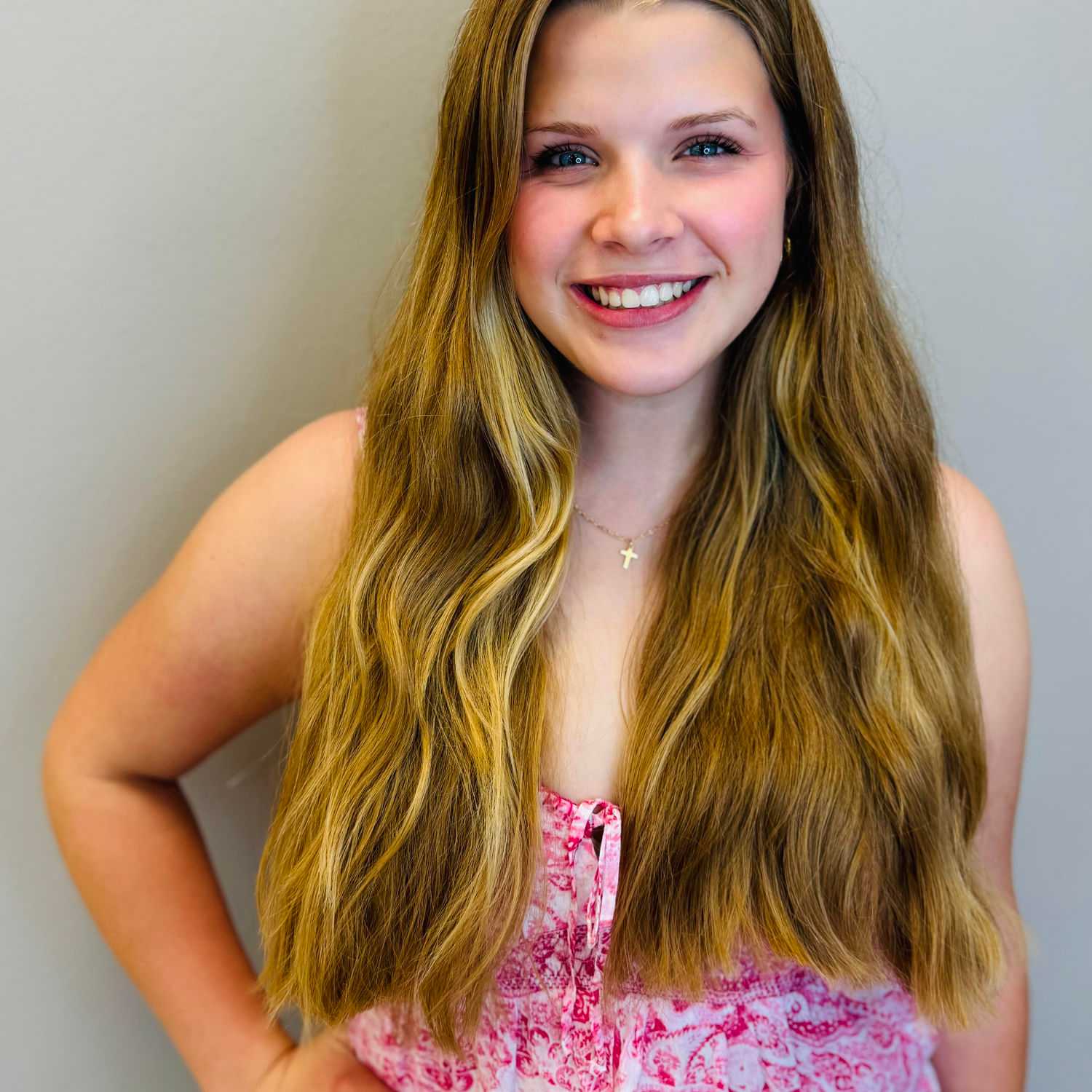 Portrait of Ireland Doyle, a professional stylist at Tommy's Salon, showcasing their expertise and style.