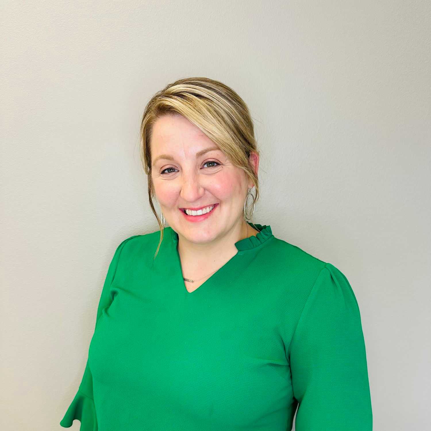 Portrait of Jennifer Schwery, a professional stylist at Tommy's Salon, showcasing their expertise and style.